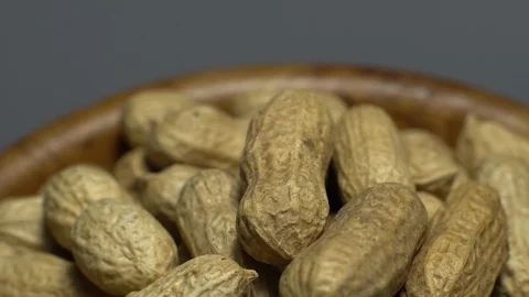 Raw Inshell Peanuts. Rotation. peanuts in shell. Snack closeup. Stock Footage 102273024