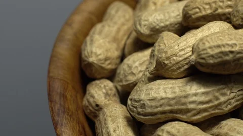 Raw Inshell Peanuts. Rotation. peanuts in shell. Snack closeup. Stock Footage 102273972