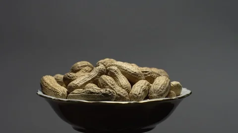 Raw Inshell Peanuts. Rotation. peanuts in shell. Snack closeup. Stock Footage 102278103