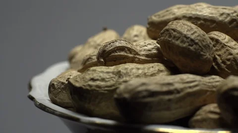 Raw Inshell Peanuts. Rotation. peanuts in shell. Snack closeup. Stock Footage 102280100