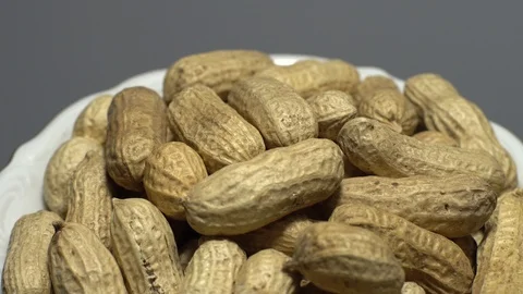 Raw Inshell Peanuts. Rotation. peanuts in shell. Snack closeup. Stock Footage 102280135