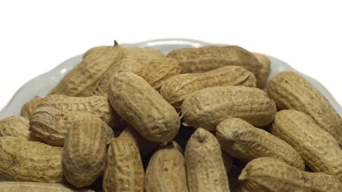 Raw Inshell Peanuts. Rotation. peanuts in shell. Snack closeup. Stock Footage 102280288