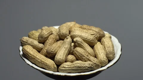 Raw Inshell Peanuts. Rotation. peanuts in shell. Snack closeup. Stock Footage 102280586