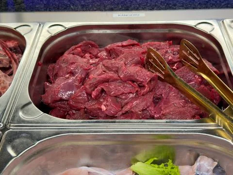 Raw kangaroo meat cuts ready for grilling at buffet Stock Photos