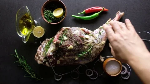 Raw lamb leg, marinated with herbs Stock Footage 82644535