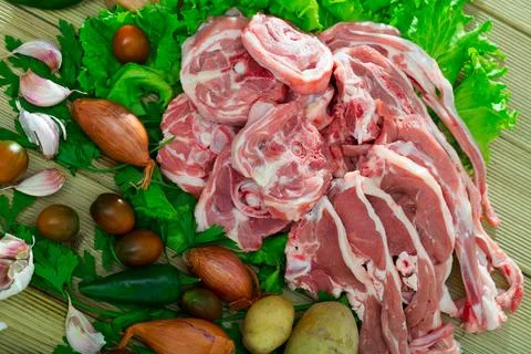 Raw lamb meat with vegetables Stock Photos