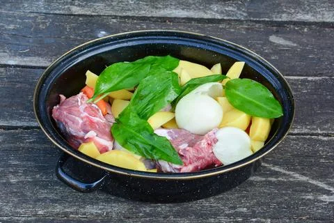 Raw lamb steaks with vegetables Stock Photos