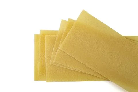 Raw lasagna sheets isolated on white Foto stock
