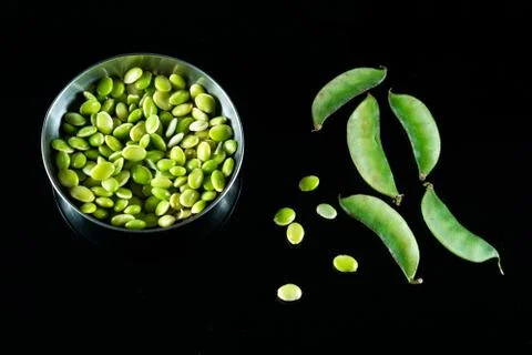 Raw Lima beans on a dark background Stock Photos
