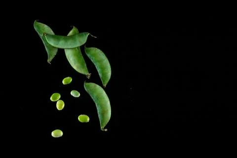 Raw Lima beans on a dark background Stock Photos