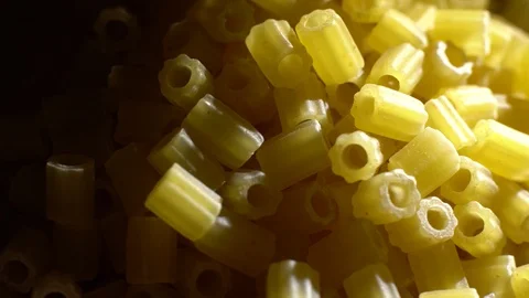 Raw macaroni in rotation. Ditalini lisci. Close up. Raw pasta. Video stock 101640059