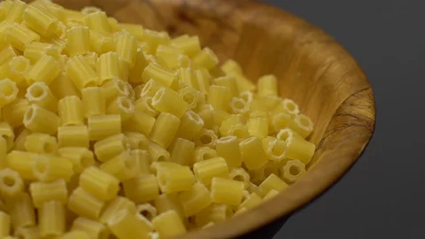Raw macaroni in rotation. Ditalini lisci. Close up. Raw pasta. Video stock 101641328