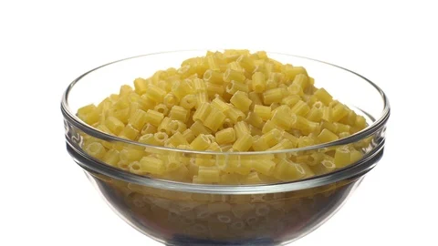 Raw macaroni in rotation. Ditalini lisci. Close up. Raw pasta. Video stock 101648183