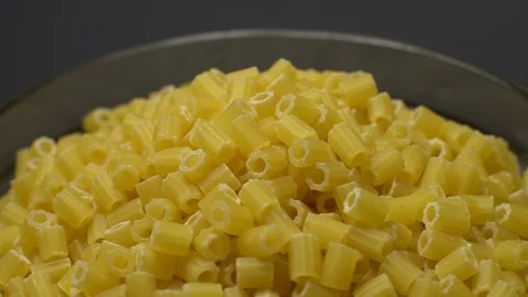 Raw macaroni in rotation. Ditalini lisci. Close up. Raw pasta. Video stock 101648216