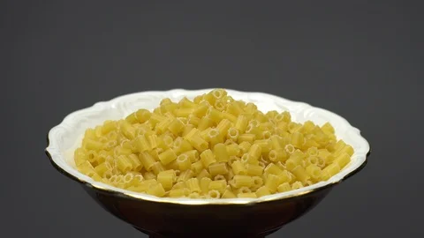 Raw macaroni in rotation. Ditalini lisci. Close up. Raw pasta. Video stock 101653376