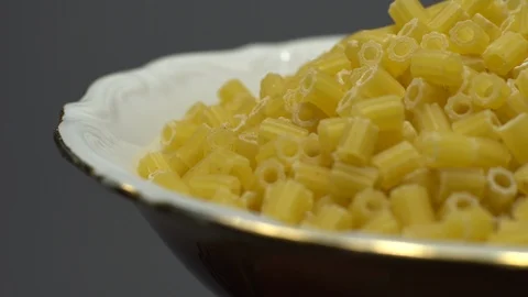 Raw macaroni in rotation. Ditalini lisci. Close up. Raw pasta. Stock Footage 101653397