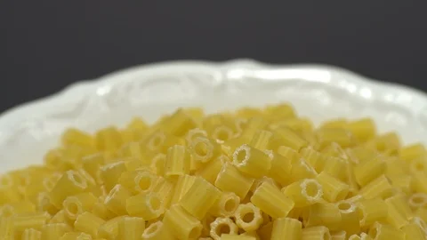 Raw macaroni in rotation. Ditalini lisci. Close up. Raw pasta. Video stock 101653686