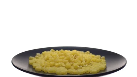 Raw macaroni in rotation. Ditalini lisci. Close up. Raw pasta. Stock Footage 101659355