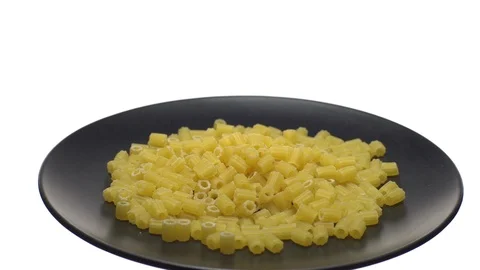 Raw macaroni in rotation. Ditalini lisci. Close up. Raw pasta. Stock Footage 101659751