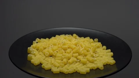 Raw macaroni in rotation. Ditalini lisci. Close up. Raw pasta. Stock Footage 101659832