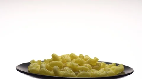 Raw macaroni in rotation. Ditalini lisci. Close up. Raw pasta. Stock Footage 101667102
