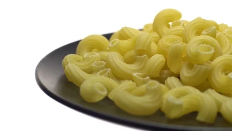 Raw macaroni in rotation. Ditalini lisci. Close up. Raw pasta. Stock Footage 101667445