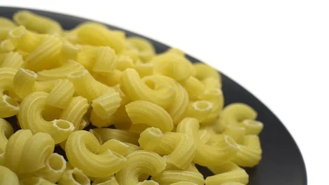 Raw macaroni in rotation. Ditalini lisci. Close up. Raw pasta. Stock Footage 101667599