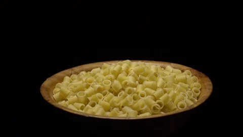 Raw macaroni in rotation. Ditalini lisci. Close up. Raw pasta. Stock Footage 101760878