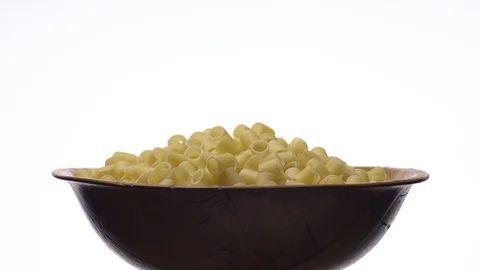 Raw macaroni in rotation. Ditalini lisci. Close up. Raw pasta. Stock Footage 101761699