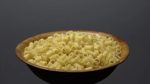 Raw macaroni in rotation. Ditalini lisci. Close up. Raw pasta. Stock Footage 101761808