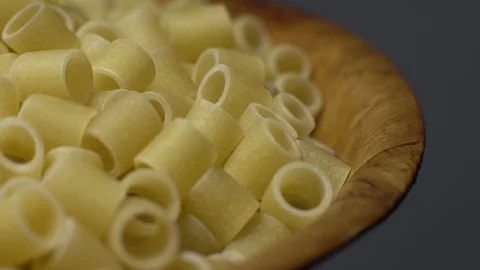 Raw macaroni in rotation. Ditalini lisci. Close up. Raw pasta. Stock Footage 101762099
