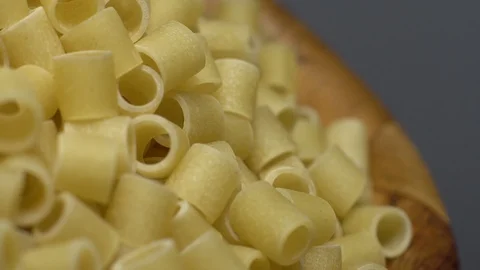 Raw macaroni in rotation. Ditalini lisci. Close up. Raw pasta. Stock Footage 101762190