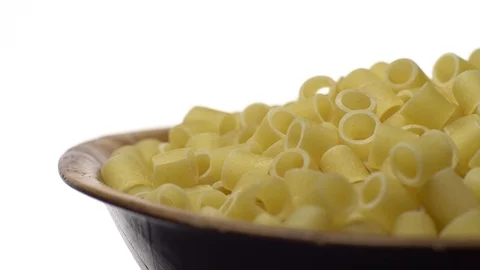 Raw macaroni in rotation. Ditalini lisci. Close up. Raw pasta. Stock Footage 101762228