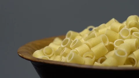 Raw macaroni in rotation. Ditalini lisci. Close up. Raw pasta. Stock Footage 101762306
