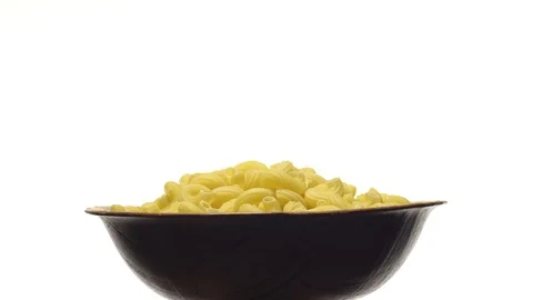 Raw macaroni in rotation. Elbow macaroni.  Macaroni rigati close up. Stock Footage 101705058
