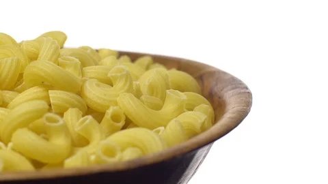 Raw macaroni in rotation. Elbow macaroni.  Macaroni rigati close up. Stock Footage 101705779
