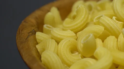 Raw macaroni in rotation. Elbow macaroni. Macaroni rigati close up. Stock Footage 101706470