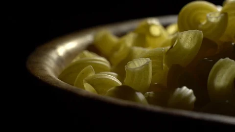 Raw macaroni in rotation. Elbow macaroni. Macaroni rigati close up. Stock Footage 101708138