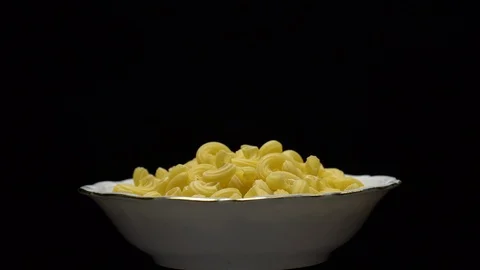 Raw macaroni in rotation. Elbow macaroni. Macaroni rigati close up. Stock Footage 101744933