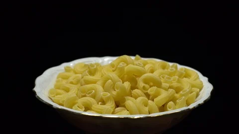 Raw macaroni in rotation. Elbow macaroni. Macaroni rigati close up. Stock Footage 101745014