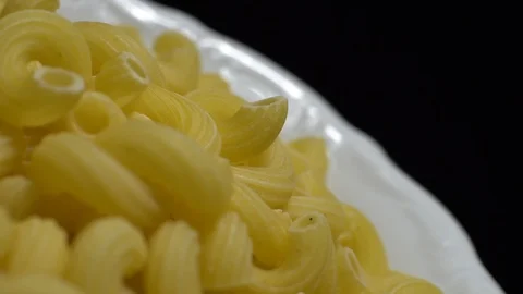 Raw macaroni in rotation. Elbow macaroni. Macaroni rigati close up. Stock Footage 101745131