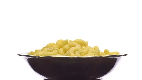 Raw macaroni in rotation. Elbow macaroni.  Macaroni rigati close up. Stock Footage 101745561