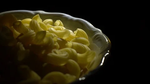 Raw macaroni in rotation. Elbow macaroni. Macaroni rigati close up. Stock Footage 101745614
