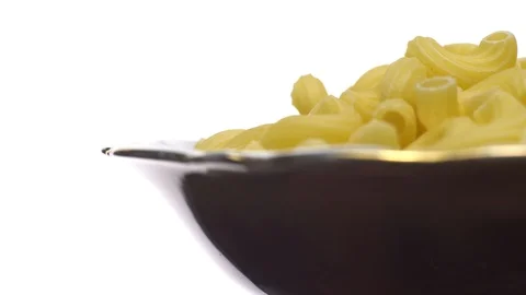 Raw macaroni in rotation. Elbow macaroni.  Macaroni rigati close up. Stock Footage 101745869