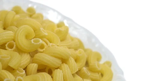 Raw macaroni in rotation. Elbow macaroni.  Macaroni rigati close up. Stock Footage 101746831