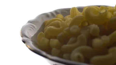 Raw macaroni in rotation. Elbow macaroni.  Macaroni rigati close up. Stock Footage 101747064