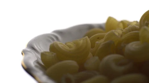 Raw macaroni in rotation. Elbow macaroni.  Macaroni rigati close up. Stock Footage 101747678