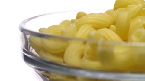 Raw macaroni in rotation. Elbow macaroni.  Macaroni rigati close up. Stock Footage 101748594
