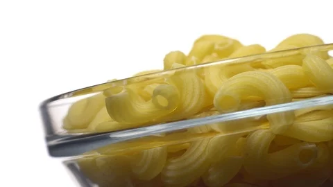 Raw macaroni in rotation. Elbow macaroni.  Macaroni rigati close up. Stock Footage 101748800