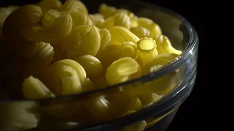 Raw macaroni in rotation. Elbow macaroni. Macaroni rigati close up. Stock Footage 101748979